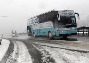 OPQS team bus in snow by Bettini